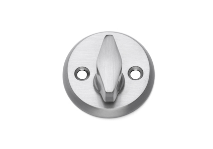 Rund metallcylinder med vred i mitten och två skruvhål, i borstat stål.