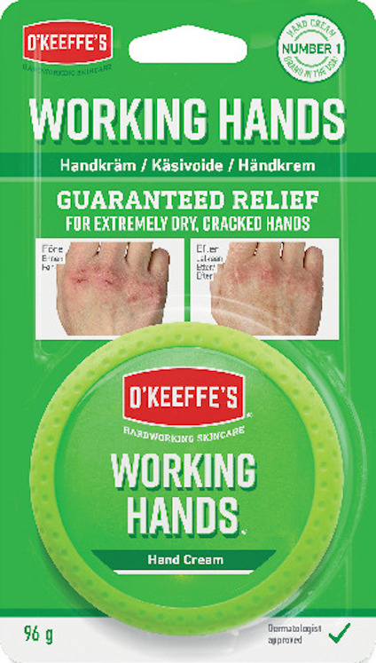 Förpackning av O'Keeffe's Working Hands handkräm, grön burk med reklamtext och bilder på händer.